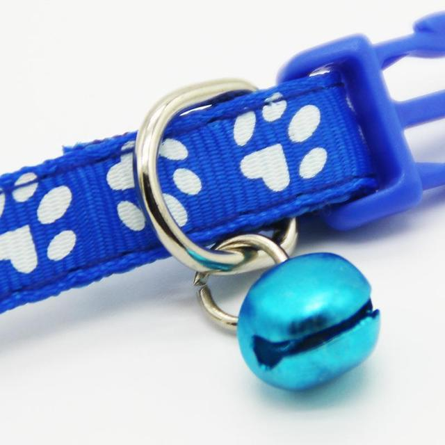The pet cat wears a bell collar — product detail